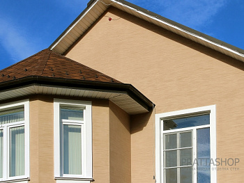 Эффект натурального травертина на фасаде дома